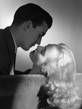 1940s 1950s Movie Star Studio Style Romantic Couple Embracing On Sofa