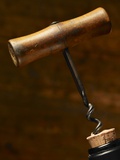 Old-Fashioned Corkscrew Uncorking Bottle
