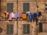 Laundry Hanging Outside Windows