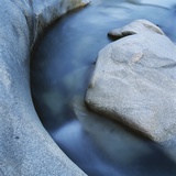 River Flowing Through Rocks