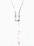 Liquid pouring out of empty bottle