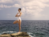 A Woman Meditating by the Sea