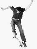 Teen Jumping Off of Skateboard