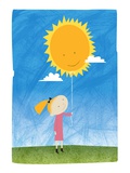 Girl holding a sun balloon