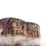 Sheer cliff rising above clouds