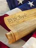 United States Constitution of top of American flag