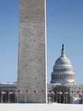 Snowy Washington Monument and U.S. Capitol building