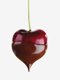 Heart cherry dipped in chocolate sauce