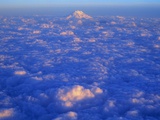 The Snowy Peak of Mount Rainier Rises Above the Clouds