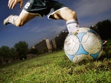 Soccer Player Kicking Ball
