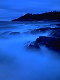 Coastline at dusk with lighthouse in background,light station @ Langara Island, Queen Charlotte Isl