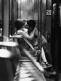 Passionate Couple Kissing in a Subway Car