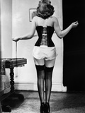 Young Woman Lacing Her Corset Photographic Print