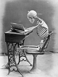 Skeleton Reading at Desk