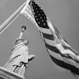 View of Statue of Liberty and American Flag
