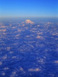 The Snowy Peak of Mount Rainier Rises Above the Clouds