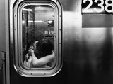 Passionate Couple Kissing in a Subway Car