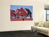 Woman Drying Laundry on Red House