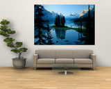 Scenic View of the Lake Surrounded by Evergreens and Snow-Capped Mountains