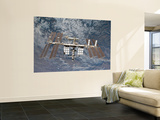 Buy The International Space Station Backdropped by a Rugged Earth Terrain at AllPosters.com