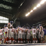New York Giants and New England Patriots - Super Bowl XLVI - February 5, 2012: Giants Huddle