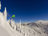 Jumping from Cliff on a Sunny Day at Whitefish Mountain Resort, Montana, Usa