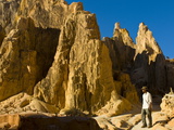 Buy Man Walking Through Strange Looking Sandstone Formations, Ankarafantsika National Park, Madagascar at AllPosters.com