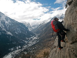 A Man on a Via Ferrata Route High Above the Tiny Village of Fressinieres, Ecrins Massif, France