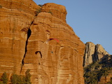 Buy A Paraglider Flies Past a Red Rock Formation, Coconino National Forest, Arizona at AllPosters.com