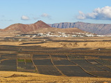 View Across Black Volcanic Cinder Fields to the Town of Soo and the Risco De Famara Range, Spain