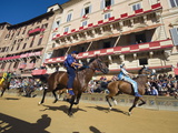 Riders Racing at El Palio Horse Race Festival, Piazza Del Campo, Siena, Tuscany, Italy, Europe
