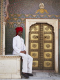 Palace Guard Sitting at Rose Gate in Pitam Niwas Chowk, City Palace, Jaipur, Rajasthan, India, Asia