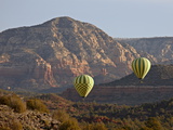 Two Hot-Air Balloons Flying Low Among Red Rock Formations, Coconino National Forest, Arizona Photographic Print