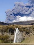 Buy Seljalandsfoss Waterfall with Ash Plume of the Eyjafjallajokull Eruption in the Distance, Iceland at AllPosters.com