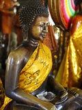 Buddha Statue With Offerings at Wat Phnom Temple, Phnom Penh, Cambodia, Indochina,