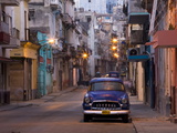View Along Quiet Street at Dawn Showing Old American Car and Street Lights Still On, Havana, Cuba