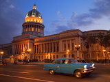 Traditional Old American Car Speeding Past the Capitolio Building at Night, Havana, Cuba