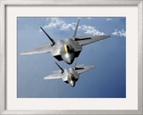 Two F-22 Raptors Fly over the Pacific Ocean