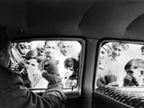 Indian children looking into puppeteer Bil Baird's car, March 1962.