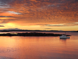 A Lobster Boat in Calm Water at Sunrise