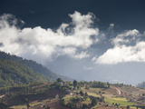 Village of Shingyer Against a Dramatic Backdrop of Mountains and Clouds, Phobjikha Valley, Bhutan, 