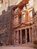 Tourist Looking Up at the Facade of the Treasury (Al Khazneh) Carved into the Red Rock at Petra, UN