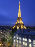France, Paris, Eiffel Tower, Viewed over Rooftops at Night