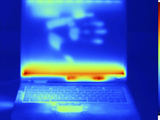 Thermogram of a Laptop Computer with a Thermal Shadow of a Hand on its Screen