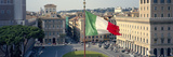 Italian Flag Fluttering with City in the Background, Piazza Venezia, Vittorio Emmanuel Ii Monume...