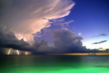 Lighting striking over green and blue water Giant Art Print