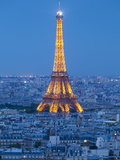 Illuminated Eiffel Tower, Viewed over Rooftops, Paris, France, Europe