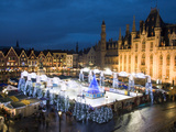Ice Rink and Christmas Market in the Market Square, Bruges, West Vlaanderen (Flanders), Belgium