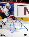 Adrian Aucoin with Puck