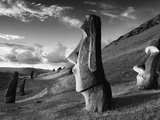 A Path Winds Past Moai Spread across Rolling Hills